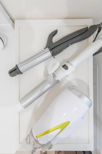 a pair of scissors in a white drawer at Seaside House Yasutaketei in Shirahama