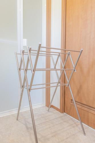a metal shelf in a room next to a door at Seaside House Yasutaketei in Shirahama