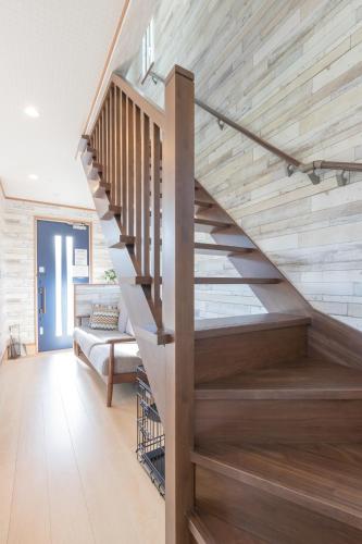 a wooden staircase in a house with a wooden floor at Seaside House Yasutaketei in Shirahama