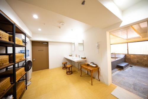 a bathroom with a sink in a room at Nagaoka Grand Hotel in Nagaoka