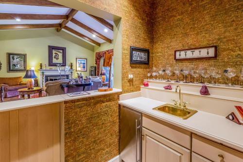 a kitchen with a sink and a living room at Eagles Nest at Big Bear Estates in Waynesville
