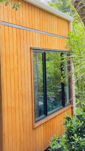 a window on the side of a house at Ora Retreat in Queenstown