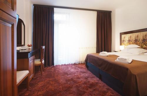 Katil atau katil-katil dalam bilik di Hotel Moldavia