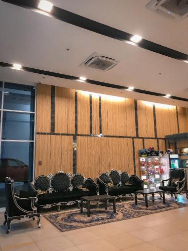 a room with a row of chairs and wooden walls at Kingston Hotel 13 - Penang Hills formerly known as Deview Hotel in Ayer Itam