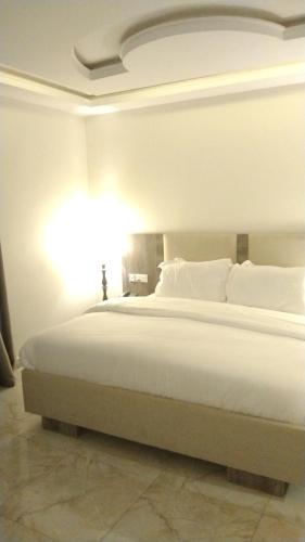 Кровать или кровати в номере Le Masik Hotel