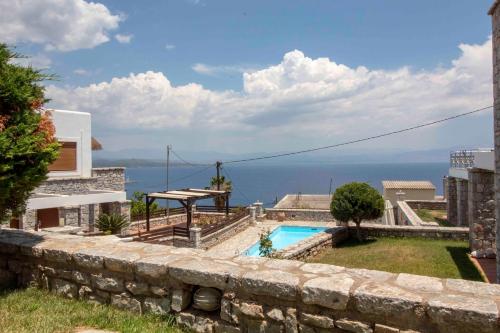 a villa with a pool and a view at Malvazios Villas #8 in Gythio