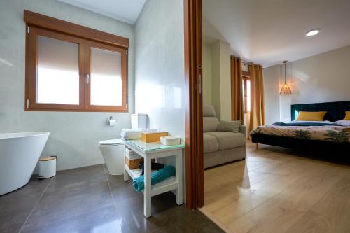 Ένα ή περισσότερα κρεβάτια σε δωμάτιο στο Dùplex Casa de las Argollas Grand Suite Parking gratis