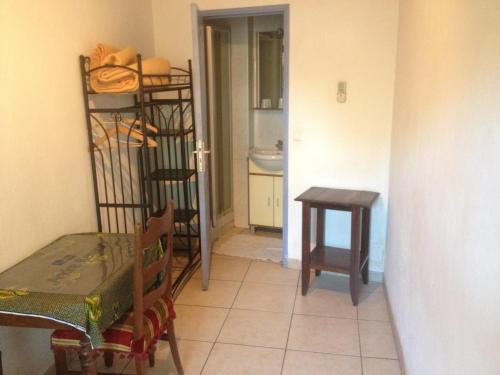 a room with a table and a table and a chair at Hostellerie du loup in Villeneuve-Loubet