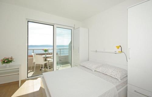 Posteľ alebo postele v izbe v ubytovaní Apartmani Mila Brela