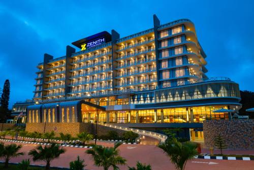 a large building with lights in front of it at Zenith Hotel Cameron in Tanah Rata