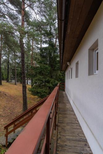 a wooden walkway leading up to a building at Penzion Sykovec in Tři Studně
