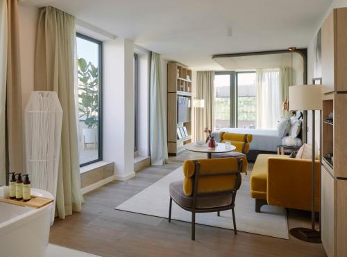 a living room with a couch and a table at ME Barcelona in Barcelona