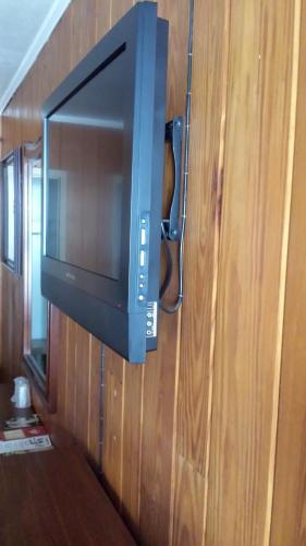 a television hanging on a wall in a room at Texas Inn Motel in Marshall