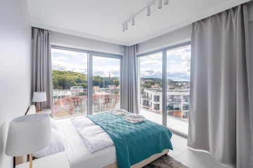 Posteľ alebo postele v izbe v ubytovaní Balticus Apartamenty Deluxe Promenada Gwiazd 14