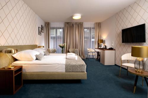 Posteľ alebo postele v izbe v ubytovaní Xerion Hotel