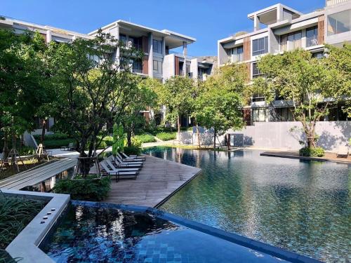 a swimming pool in the middle of a building at The Khao Yai in Phayayen