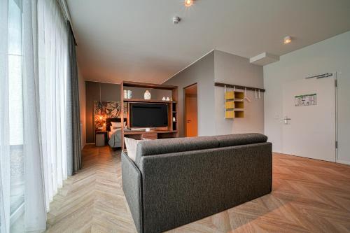 TV a/nebo společenská místnost v ubytování Vienna House Easy by Wyndham Augsburg