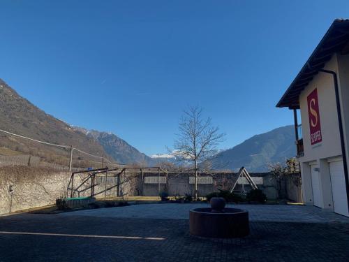 an empty parking lot in front of a building at Hof Schupfer - Alpstay in Naturno