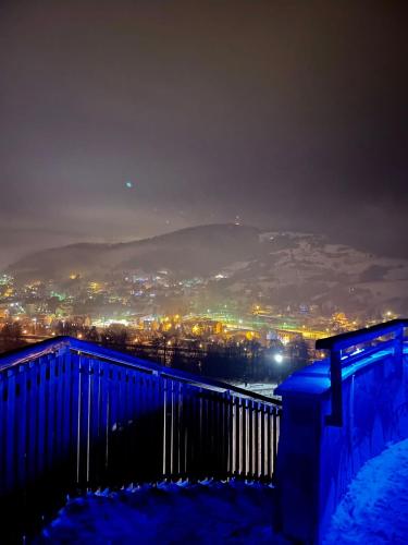 a view of a city at night at Apartament Muszyna in Muszyna