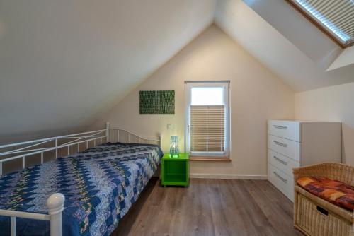 Ένα ή περισσότερα κρεβάτια σε δωμάτιο στο Das Blaue Haus