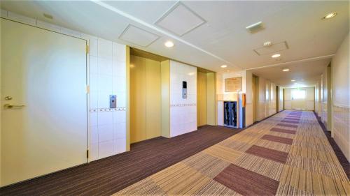 an empty hallway of an office building at Meitetsu Inn Nagoya Kanayama in Nagoya