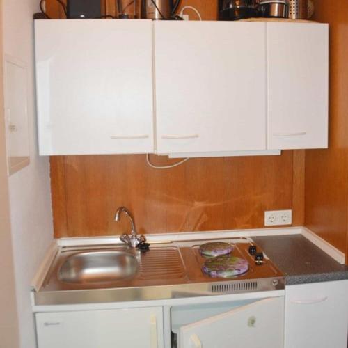 A kitchen or kitchenette at Apartmenthaus Spreewaldperle