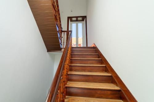 a staircase in a house with wooden floors at Albor Suites in Santa Brígida