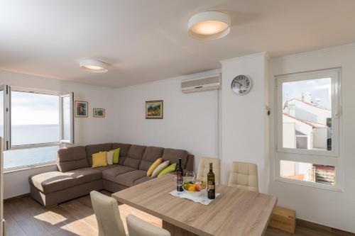 a living room with a couch and a table at Apartment Gigi in Dubrovnik