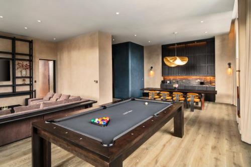 a billiard room with a pool table and a bar at Nobu Hotel Chicago in Chicago