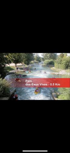 a picture of a river with people in the water at Modern Living in Huningue