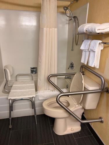 a bathroom with a toilet and a shower at Quality Inn in Hermitage