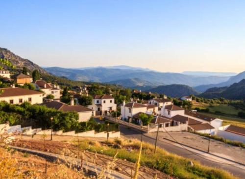 a view of a town with mountains in the background at Con el Alma in Benaocaz