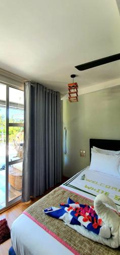 Katil atau katil-katil dalam bilik di Himandhoo Travel & Stays