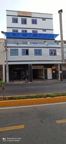 a building with a hotel on the side of a street at Hotel Bucarica Plaza in Bucaramanga