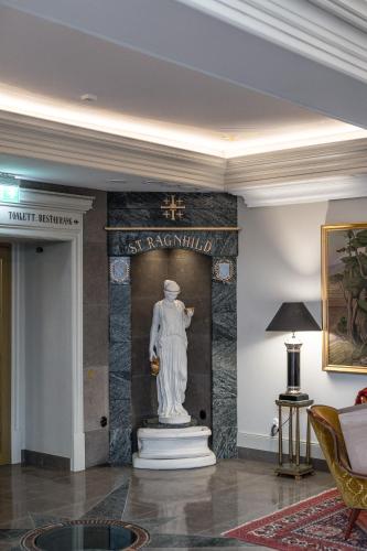 a statue in the lobby of a building at Söderköpings Brunn in Söderköping
