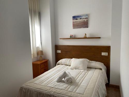 Tempat tidur dalam kamar di Casa Manolito