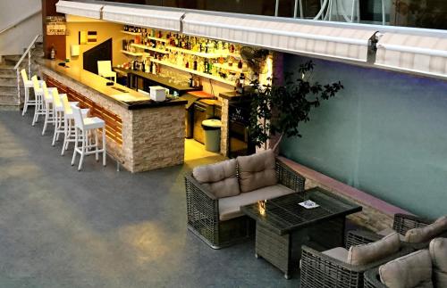 an overhead view of a restaurant with a bar and chairs at Rhapsody Hotel & Spa Kalkan in Kalkan