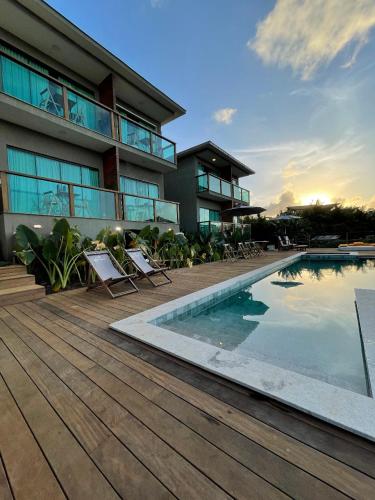 a resort with a swimming pool and a building at Miragem Noronha in Fernando de Noronha