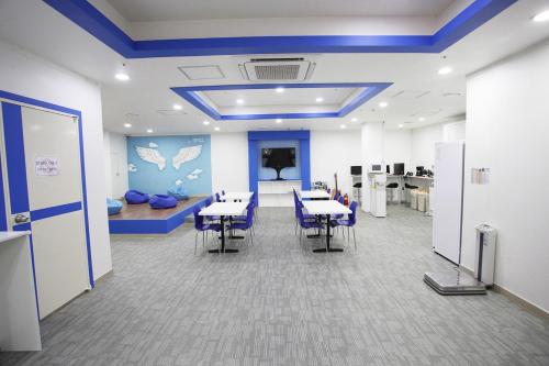 an office with tables and chairs in a room at Namsan Guesthouse in Seoul