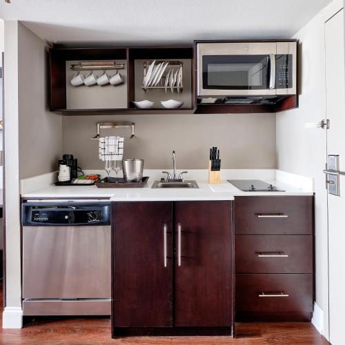 a kitchen with a sink and a microwave at Comfort Inn & Suites Pottstown Eastern Gateway in Pottstown
