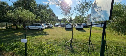 a bunch of cars parked in a parking lot at Riviera Inn apartments in Ulcinj