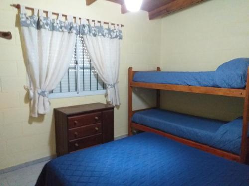 Voodi või voodid majutusasutuse Cabanas Valle Azul toas