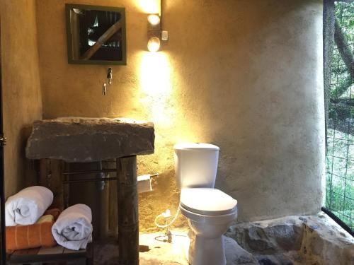Et badeværelse på Glamping El Árbol en la Casa