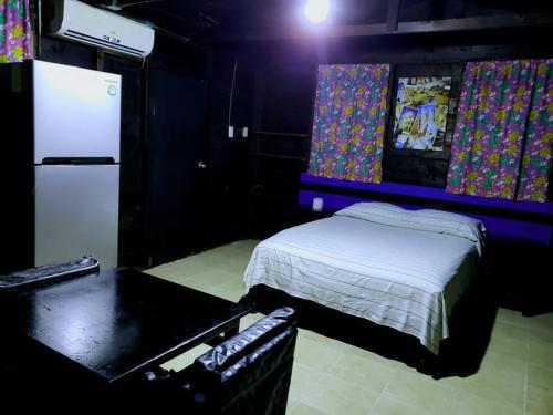 Postel nebo postele na pokoji v ubytování ECO-CABAÑAS Cancún