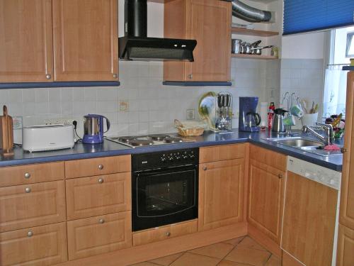 Kuchyň nebo kuchyňský kout v ubytování Ferienhaus Anna Maria