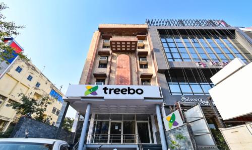 a treeoco sign in front of a building at Treebo Trend Siddharth in Ajmer