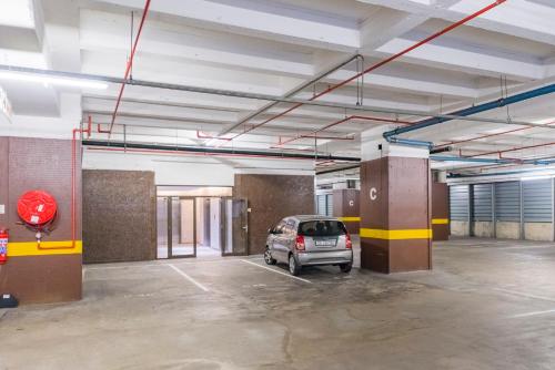 a car parked in an empty parking lot at #1803 Cartwright - Simply Spectacular in Cape Town