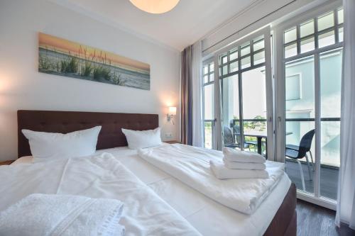 Katil atau katil-katil dalam bilik di Villa Westend - Wohnung 14
