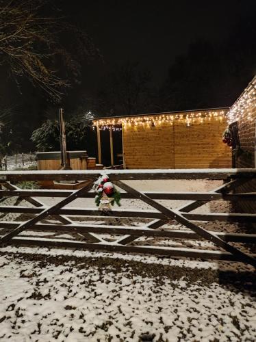 a santa claus on a fence in the snow at Au Pré de Mukky in Andenne