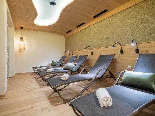 a row of chairs lined up in a room at Hotel Tiroler Herz in Hinterhornbach